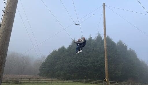 Anna and Shaun enjoying the king swing on a learning disability short break